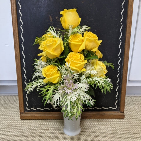 A dozen yellow roses arrangement